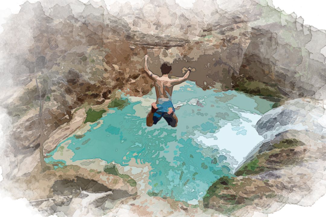 time lapse photography of man jumping on waterfalls