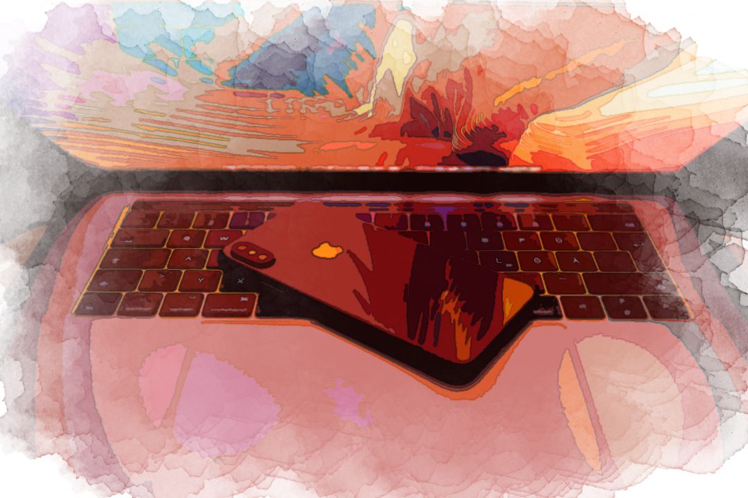 space gray iPhone X on MacBook