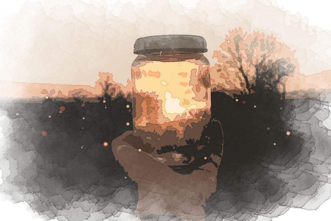 person holding glass jar