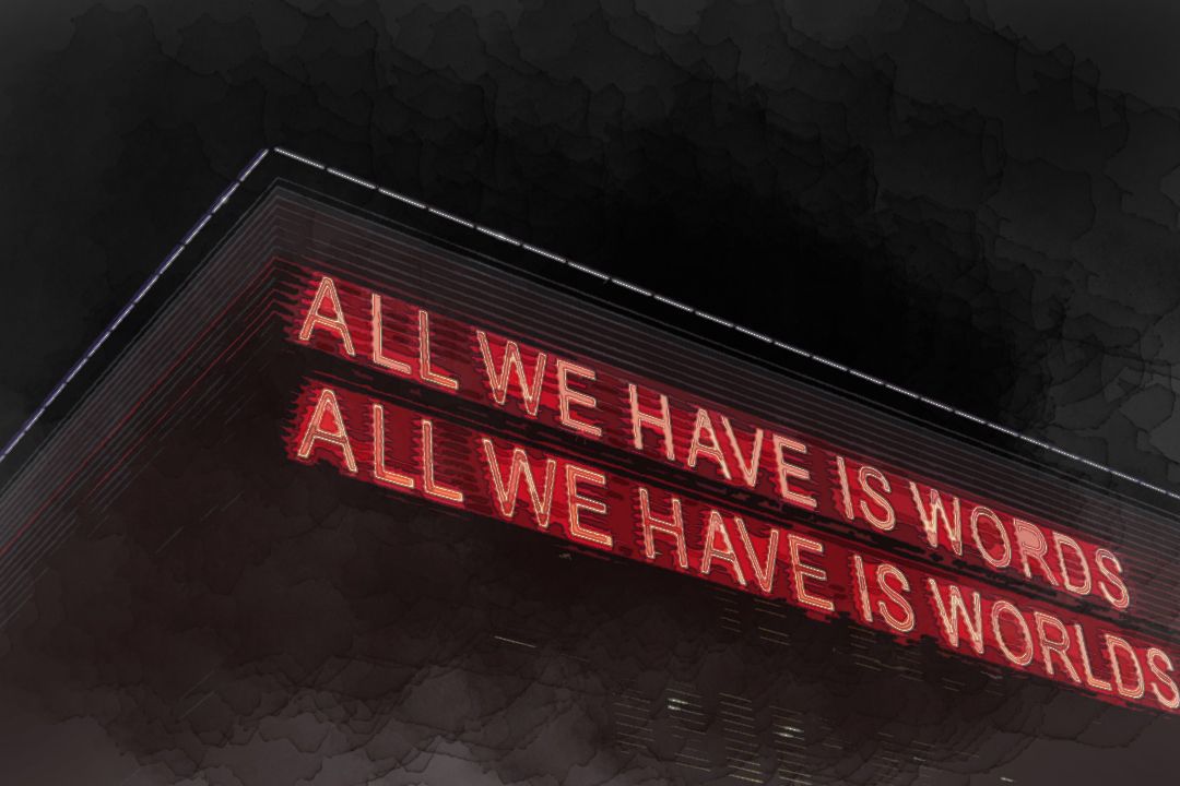 All We Have Is Words All We Have Is Worlds lighted signage at night