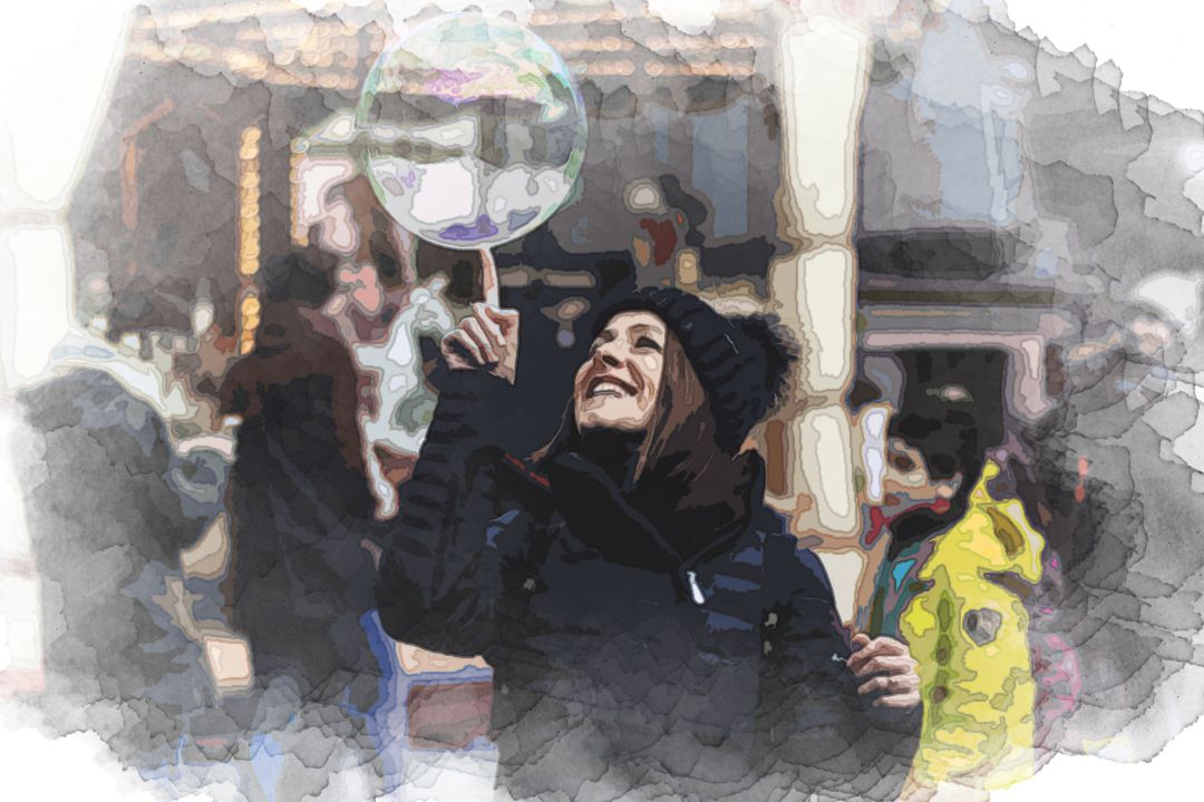 woman touching bubble on mid air