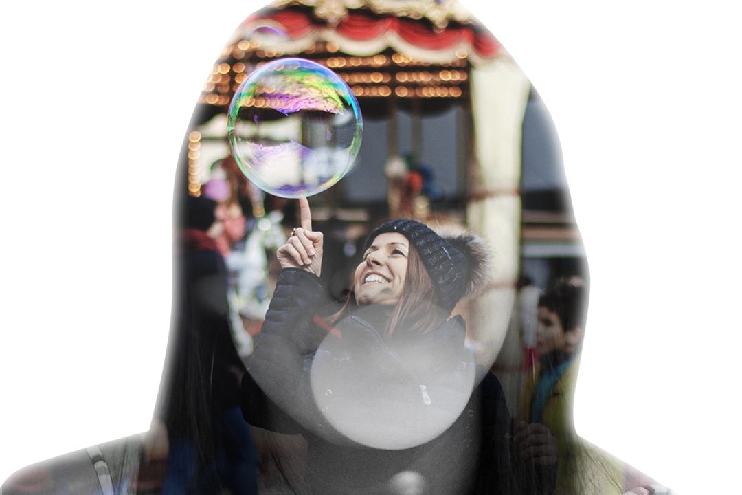 woman touching bubble on mid air