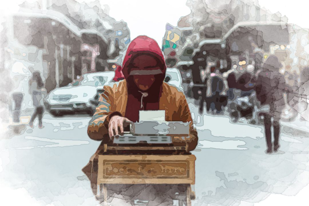 man sitting on table typing on typewriter
