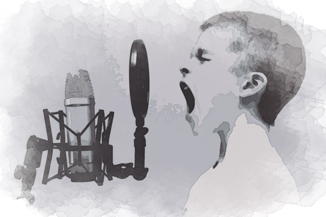 boy singing on microphone with pop filter