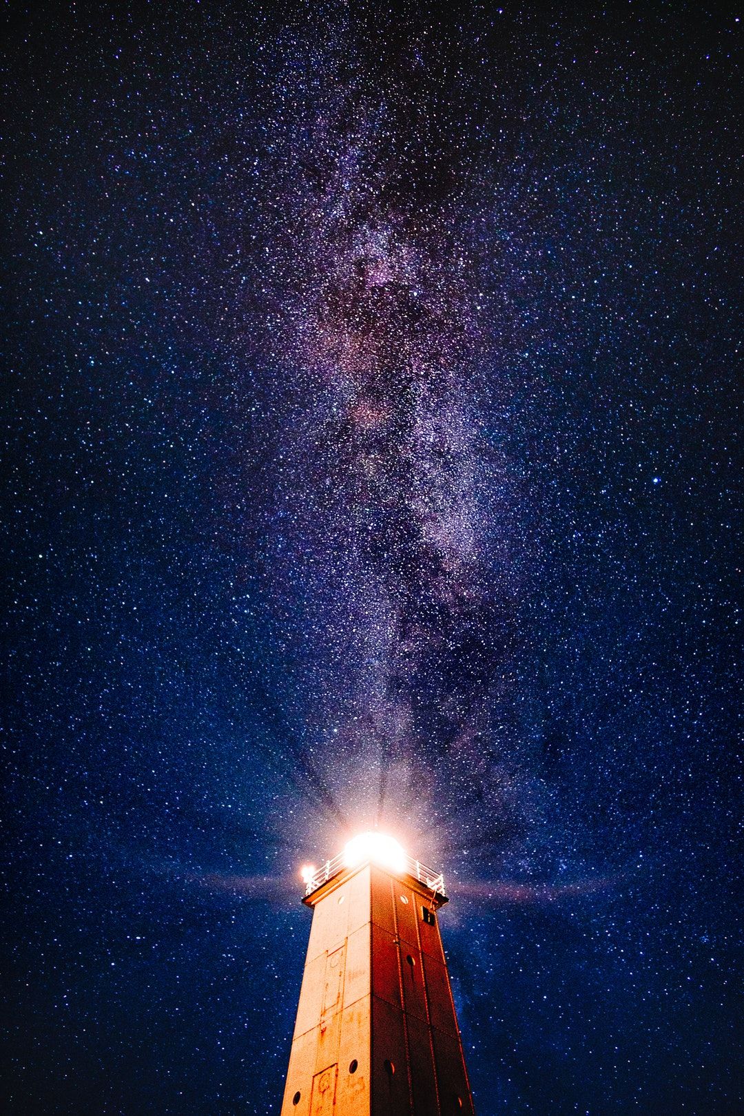 lighthouse under purple galaxy